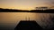 POV moving alone the small wooden pier at a calm lake at twilight in Finland