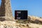 POV Proof of value symbol. Concept words POV Proof of value on beautiful black chalk blackboard. Beautiful stone beach blue sky