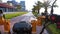 POV Riding an electric bike on a red bike path with palm trees in the resort town