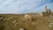 POV sheeps walks, Remains of the minaret, ruins of Date Harran University South of Turkey, border with Syria