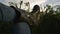 POV shot of a farmer`s feet in rubber boots in a field, closeup