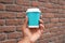 pov shot of holding a Blank take away kraft coffee cup