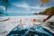 POV shot of man wear blue swimming shorts laying on a beautiful sandy tropical beach Anse Cosos, La Digue, Seychelles