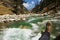 POV shot of a traveller on the bridge of a river