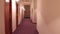 POV steadicam walk through generic old hotel corridor. 4K video