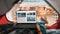 POV of a Tourist Using a Laptop Computer for Checking Latest or Breaking News. Traveller Resting in