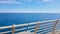 POV of tourist walking on cruise upper deck, clean blue sea, ecology concept