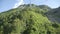 Pov tracking shot on moving cableway above mountain slope at summer. Amazing nature landscape