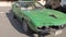 Pov of vintage veteran sport green car with beautiful model Alfa Romeo Montreal manufactured by Italian Alfa Romeo dal form 1970
