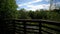 POV walking in the forest on a concrete path wooden deck and river scene in rural Georgia