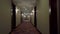 POV of walking in long corridor in a hotel