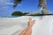 POV of a woman lay on a hammock relaxing in Muri lagoon in Rarotonga Cook Islands