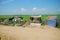 Poverty huts with green paddy field