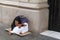 Poverty-stricken female beggar