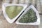 powder and moringa leaves in bowl