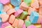 Powdered candies in various colors and shapes. Sweets for children. Sugar and calories