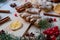 Powdered ginger close up with blurred traditional spices for Christmas bakery orange, anise, cinnamon, anise on wooden background