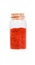 Powdered pimienta roja red pepper in a glass bottle with cork st