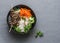 Power balanced buddha bowl. Asian style beef skewers, rice vermicelli, pickled vegetables salad carrots, cucumbers, radishes, herb