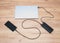 Power bank with usb-c cable is charging laptop and smartphone. Modern, information technology