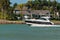 Power boat speeding along a tropical canal