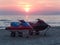 Power boats jet ski on the beach at sunset