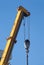 Power crane top with heavy over blue sky