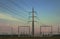 Power electricity pylons sunset