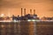 Power generation plant in New York City at night time on river bank