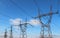 power high voltage tower over blue sky