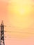 Power line pillar. High-voltage power lines at sunset