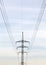 Power line pole with cables and wire black silhouette on sky background front closeup view