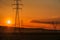 Power line towers at sunset