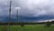 Power lines against a cloudy sky before the rain. The rapid movement of rain clouds.