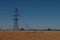 Power lines cross a grain field in Denmark