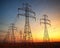 power lines with electricity pylons at twilight.