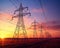 power lines with electricity pylons at twilight.