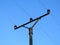 Power lines and insulators high above the ground.