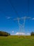 Power Lines Over Green Field, Blue Sky