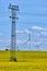 Power lines with pylon and wind turbines