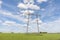 Power lines pylons next to a field