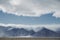 Power lines running in front of mountains