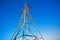 Power lines steel construction against blue sky