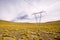 Power lines towers in the Altiplano high Andean plateau at 4200 meters over the sea level, Atacama desert, Antofagasta Region, C