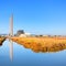 Power plant with smoke stacks and reflection