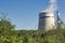 Power plant steam cooling tower on blue sky background