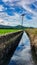 power pole, sky, water, cabal, irrigation, rice field, mountain.