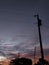 Power poles in the evening twilight with charming clouds