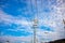 Power poles and solar street lights under the blue sky