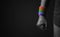 Power, Protest and Expression for LGBTQ, Rights Concept. Closeup of Fist and Rainbow Wrist Strap. Angry, Ready to Punch